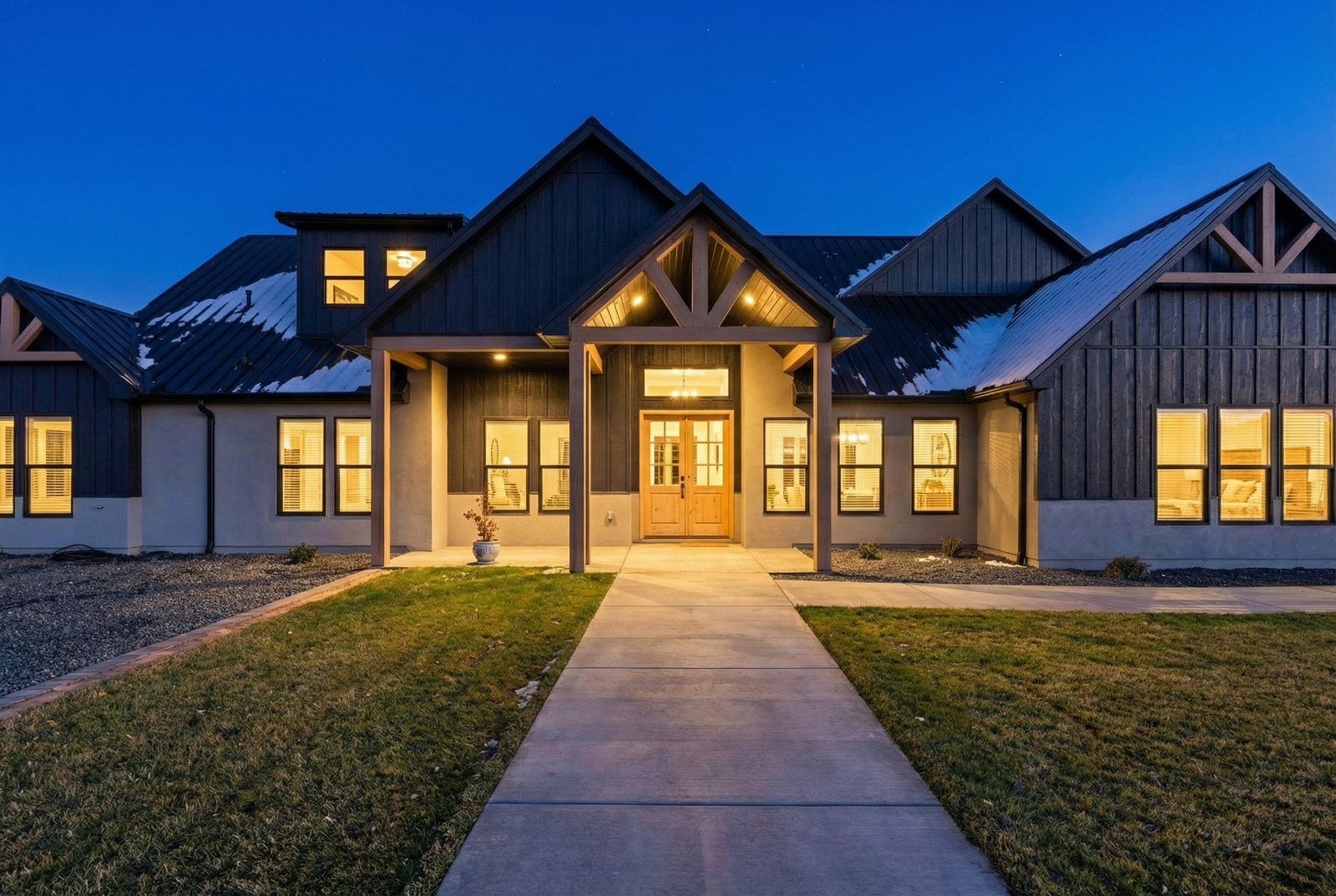 Modern Farmhouse custom home at dusk at 1108 8th St NE, Rio Rancho NM by Solano Builders