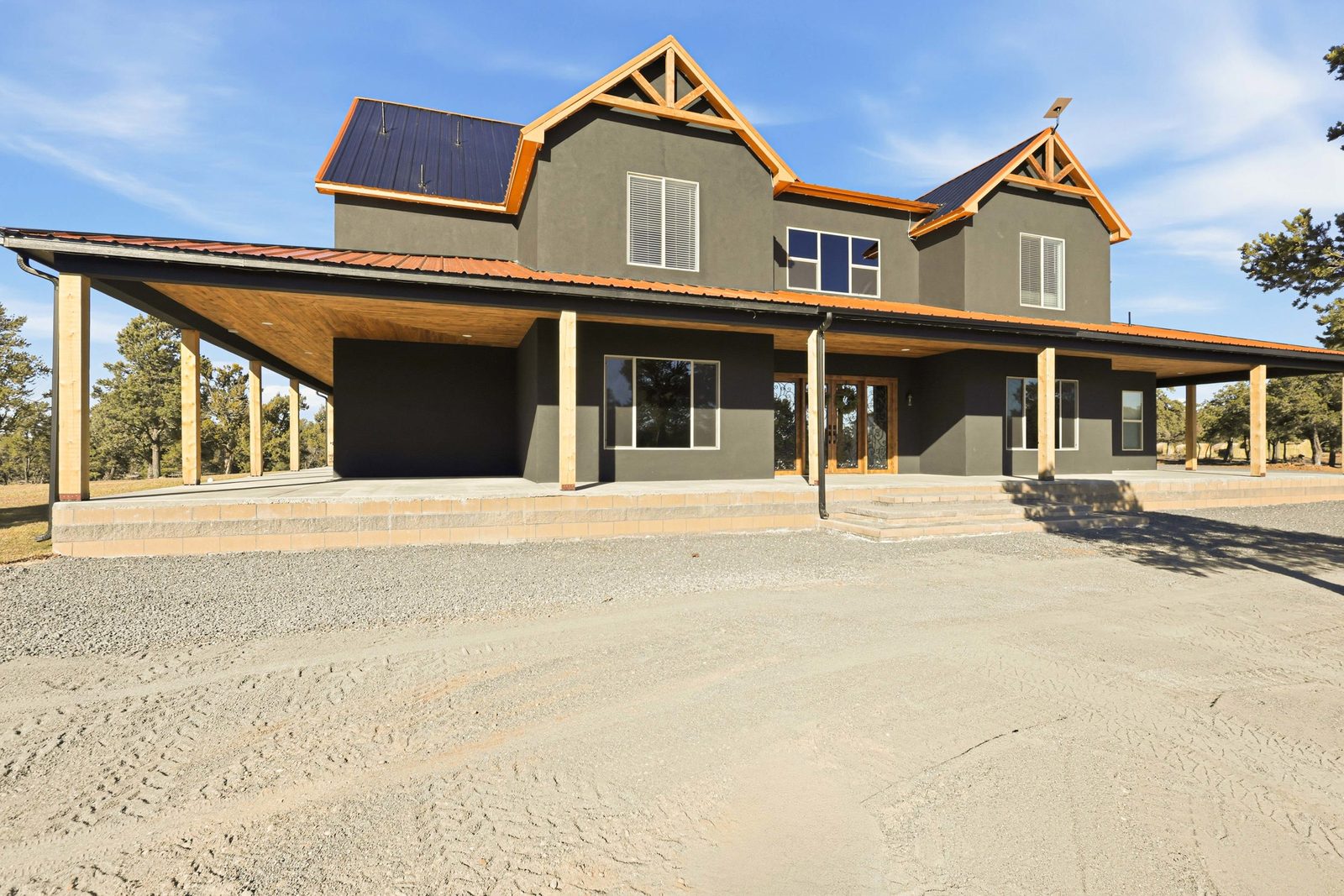 Modern Farmhouse custom home with copper standing-seam roof in Lindrith NM by Solano Builders